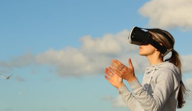 woman using vr goggles outdoors